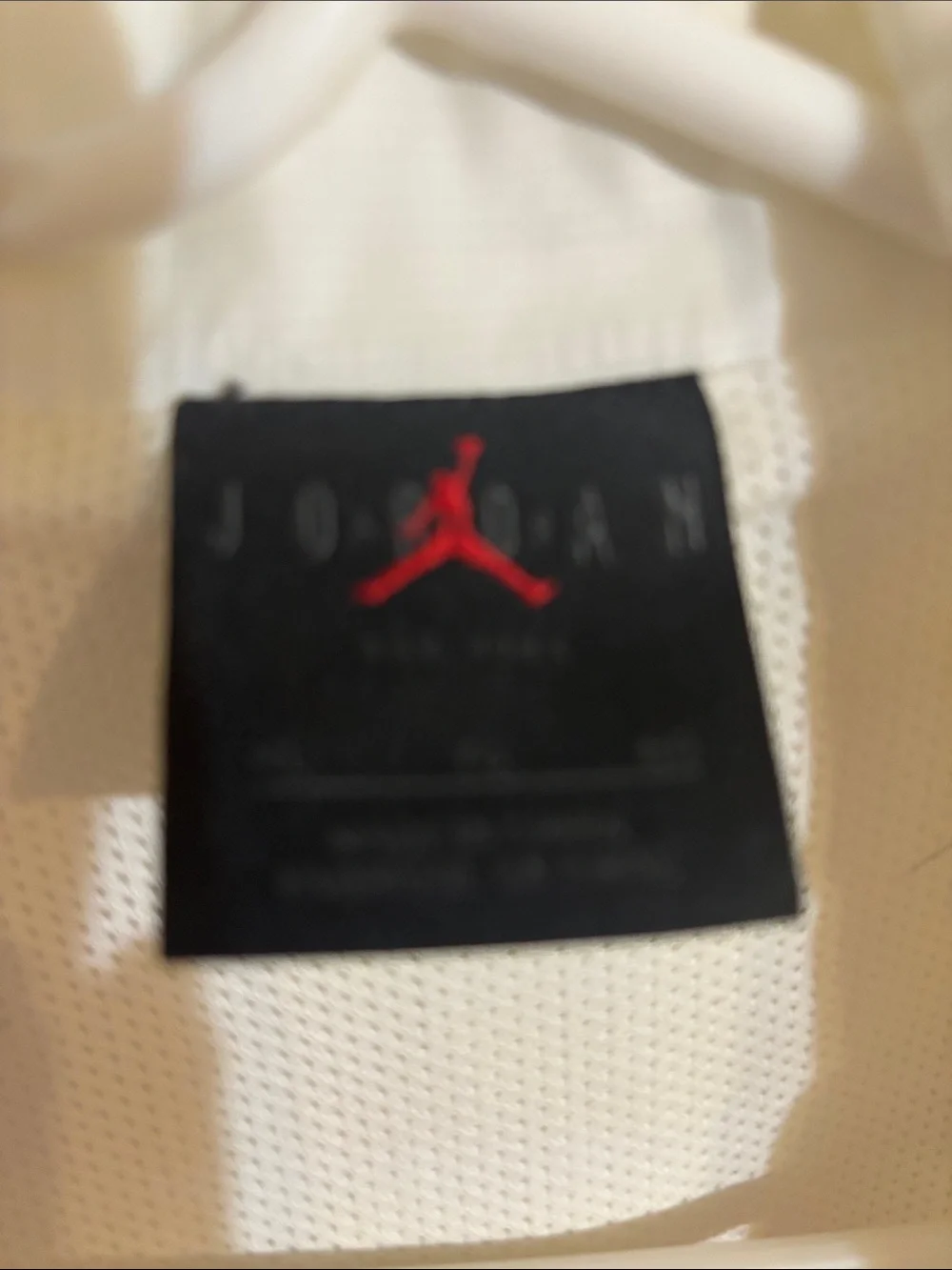 Jordan White Windbreaker with Orange and Red Accents